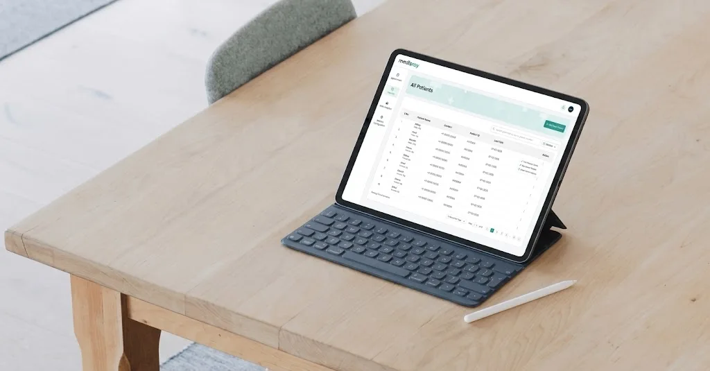 Tablet displaying clinic software features in India for appointments, billing, EMR, and patient management.
